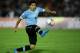 MONTEVIDEO, URUGUAY - NOVEMBER 20: Luis Suarez of Uruguay runs with the ball during leg 2 of the FIFA World Cup Qualifier match between Uruguay and Jordan at Centenario Stadium Stadium on November 20, 2013 in Montevideo, Uruguay. (Photo by Friedemann Vo