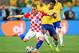 SAO PAULO, BRAZIL - JUNE 12: Paulinho of Brazil challenges Luka Modric of Croatia during the 2014 FIFA World Cup Brazil Group A match between Brazil and Croatia at Arena de Sao Paulo on June 12, 2014 in Sao Paulo, Brazil. (Photo by Buda Mendes/Getty Ima