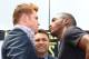 LOS ANGELES, CA - MAY 06: Boxers Canelo Alvarez (L) and Erislandy Lara (R) face off as Oscar De La Hoya (C), president of Golden Boy Promotions, looks on during the press tour for Canelo Alvarez v Erislandy Lara on May 6, 2014 in Los Angeles, California.