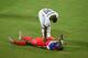 NATAL, BRAZIL - JUNE 16: Jonathan Mensah of Ghana stands over an injured Jozy Altidore during the 2014 FIFA World Cup Brazil Group G match between Ghana and the United States at Estadio das Dunas on June 16, 2014 in Natal, Brazil. (Photo by Laurence Gri
