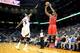 Apr 2, 2014; Atlanta, GA, USA; Chicago Bulls guard Jimmy Butler (21) shoots a three over Atlanta Hawks forward DeMarre Carroll (5) in the first half at Philips Arena. Mandatory Credit: Daniel Shirey-USA TODAY Sports