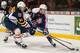 WINDSOR, ON - FEBRUARY 27: Brendan Lemieux #21 of the Barrie Colts battles for the puck against Ben Johnson #12 of the Windsor Spitfires on February 27, 2014 at the WFCU Centre in Windsor, Ontario, Canada. (Photo by Dennis Pajot/Getty Images)
