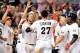 Apr 18, 2014; Miami, FL, USA; Miami Marlins right fielder Giancarlo Stanton (27) celebrates with teammates after hitting a grand slam to win the game 8-4 against the Seattle Mariners at Marlins Ballpark. Mandatory Credit: Steve Mitchell-USA TODAY Sports