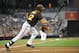 SAN DIEGO, CA - MAY 23: San Diego Padres left fielder Seth Smith #12 hits an RBI single during the first inning of a baseball game against the Chicago Cubs at Petco Park May 23, 2014 in San Diego, California. (Photo by Denis Poroy/Getty Images)