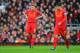 LIVERPOOL, ENGLAND - APRIL 21: Steven Gerrard (L) of Liverpool and team mate Luis Suarez look dejected after the opening goal by Oscar of Chelsea during the Barclays Premier League match between Liverpool and Chelsea at Anfield on April 21, 2013 in Liverp