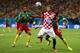 MANAUS, BRAZIL - JUNE 18: Mario Mandzukic of Croatia controls the ball as Nicolas N'Koulou and Joel Matip of Cameroon give chase during the 2014 FIFA World Cup Brazil Group A match between Cameroon and Croatia at Arena Amazonia on June 18, 2014 in Manaus