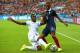 PORTO ALEGRE, BRAZIL - JUNE 15: Brayan Beckeles of Honduras challenges Patrice Evra of France during the 2014 FIFA World Cup Brazil Group E match between France and Honduras at Estadio Beira-Rio on June 15, 2014 in Porto Alegre, Brazil. (Photo by Ian Wa
