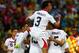 FORTALEZA, BRAZIL - JUNE 14: Giancarlo Gonzalez of Costa Rica jumps on his teammates as they celebrate the team's second goal by Oscar Duarte (obscured) during the 2014 FIFA World Cup Brazil Group D match between Uruguay and Costa Rica at Castelao on Jun