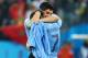 SAO PAULO, BRAZIL - JUNE 19: Luis Suarez of Uruguay hugs teammate Cristian Rodriguez after defeating England 2-1 during the 2014 FIFA World Cup Brazil Group D match between Uruguay and England at Arena de Sao Paulo on June 19, 2014 in Sao Paulo, Brazil.