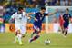 NATAL, BRAZIL - JUNE 19: Giorgos Karagounis of Greece challenges Shinji Kagawa of Japan during the 2014 FIFA World Cup Brazil Group C match between Japan and Greece at Estadio das Dunas on June 19, 2014 in Natal, Brazil. (Photo by Jamie McDonald/Getty