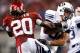 ARLINGTON, TX - SEPTEMBER 05: Tight end Dennis Pitta #32 of the Brigham Young Cougars runs the ball past Quinton Carter #20 of the Oklahoma Sooners at Cowboys Stadium on September 5, 2009 in Arlington, Texas. (Photo by Ronald Martinez/Getty Images)