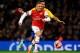 LONDON, ENGLAND - JANUARY 24: Kieran Gibbs of Arsenal chases the ball with Cyrus Christie of Coventry City during the FA Cup with Budweiser Fourth round match between Arsenal and Coventry City at Emirates Stadium on January 24, 2014 in London, England.