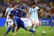 RIO DE JANEIRO, BRAZIL - JUNE 15: Lionel Messi of Argentina controls the ball on his way to scoring his team's second goal against Ermin Bicakcic (L) and Muhamed Besic of Bosnia and Herzegovina during the 2014 FIFA World Cup Brazil Group F match between A