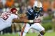 AUBURN, AL - AUGUST 31: Quarterback Nick Marshall #14 of the Auburn Tigers tries to stiff arm nose tackler Ioane Gauta #95 of the Washington State Cougars during the first half of play on August 31, 2013 at Jordan-Hare Stadium in Auburn, Alabama. At half