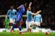 MANCHESTER, ENGLAND - FEBRUARY 15: Alvaro Negredo (R) of Manchester City is tackled by Jon Obi Mikel (L) of Chelsea during the FA Cup Fifth Round match between Manchester City and Chelsea at the Etihad Stadium on February 15, 2014 in Manchester, England.