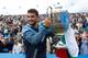 Grigor Dimitrov of Bulgaria holds up the trophy after winning the Aegon Championship
