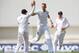 LEEDS, ENGLAND - JUNE 20: Stuart Broad of England, right, celebrates taking the wicket of Dinesh Chandimal of Sri Lanka during day one of 2nd Investec Test match between England and Sri Lanka at Headingley Cricket Ground on June 20, 2014 in Leeds, England