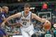 Mar 23, 2014; Minneapolis, MN, USA; Minnesota Timberwolves forward Kevin Love (42) dribbles in the fourth quarter against the Phoenix Suns forward P.J. Tucker (17) at Target Center. Phoenix wins 127-120. Mandatory Credit: Brad Rempel-USA TODAY Sports