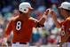 Jun 20, 2014; Omaha, NE, USA; Texas Longhorns runner Brooks Marlow (8) celebrates his triple with assistant Ryan Russ (10) against the Vanderbilt Commodores during game eleven of the 2014 College World Series at TD Ameritrade Park Omaha. Mandatory Credit: