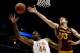 MILWAUKEE, WI - MARCH 20: Prince Ibeh #44 of the Texas Longhorns and Jordan Bachynski #13 of the Arizona State Sun Devils vie for a rebound in the first half during the second round of the 2014 NCAA Men's Basketball Tournament at BMO Harris Bradley Cente