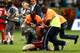 SALVADOR, BRAZIL - JUNE 20: Security personnel tackle a pitch invader after the match during the 2014 FIFA World Cup Brazil Group E match between Switzerland and France at Arena Fonte Nova on June 20, 2014 in Salvador, Brazil. (Photo by Adam Pretty/Gett