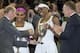 July 7, 2012; London, UNITED KINGDOM; Serena Williams (USA), left, and Venus Williams (USA) are presented with trophies after defeating Andrea Hlavackova (CZE) and Lucie Hradecka (CZE) in the women's doubles finals of the 2012 Wimbledon Championships at t