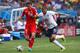 SALVADOR, BRAZIL - JUNE 20: Stephan Lichtsteiner of Switzerland controls the ball against Karim Benzema of France during the 2014 FIFA World Cup Brazil Group E match between Switzerland and France at Arena Fonte Nova on June 20, 2014 in Salvador, Brazil.