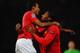 MANCHESTER, ENGLAND - NOVEMBER 02: Antonio Valencia of Manchester United (R) celebrates with Luis Nani as he scores their first goal during the UEFA Champions League Group C match between Manchester United and Otelul Galati at Old Trafford on November 2,