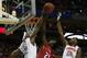 Mar 22, 2014; Buffalo, NY, USA; Dayton Flyers forward Dyshawn Pierre (21) has his shot blocked by Syracuse Orange forward C.J. Fair (5) in the second half of a men's college basketball game during the third round of the 2014 NCAA Tournament at First Niaga