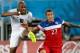 Jun 16, 2014; Natal, Rio Grande do Norte, BRAZIL; United States defender Fabian Johnson (23) tries to block a shot by Ghana midfielder Andre Ayew (10) during the second half of their 2014 World Cup game at Estadio das Dunas. Mandatory Credit: Winslow Town