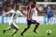 LISBON, PORTUGAL - MAY 24: Filipe Luis of Club Atletico de Madrid takes on Luka Modric of Real Madrid during the UEFA Champions League Final between Real Madrid and Atletico de Madrid at Estadio da Luz on May 24, 2014 in Lisbon, Portugal. (Photo by Laur