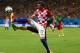 MANAUS, BRAZIL - JUNE 18: Mario Mandzukic of Croatia controls the ball as Nicolas N'Koulou of Cameroon gives chase during the 2014 FIFA World Cup Brazil Group A match between Cameroon and Croatia at Arena Amazonia on June 18, 2014 in Manaus, Brazil. (Ph