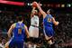 BOSTON, MA - MARCH 5: Andrew Bogut #12 of the Golden State Warriors blocks a shot against Jerryd Bayless #11 of the Boston Celtics on March 5, 2014 at the TD Garden in Boston, Massachusetts. NOTE TO USER: User expressly acknowledges and agrees that, by d