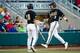 Jun 21, 2014; Omaha, NE, USA; Vanderbilt Commodores infielder Vince Conde (3) celebrates with outfielder Nolan Rogers (18) after scoring against the Texas Longhorns during game thirteen of the 2014 College World Series at TD Ameritrade Park Omaha. Mandato