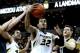 Feb 19, 2014; Columbia, MO, USA; Missouri Tigers guard Jabari Brown (32) goes for a basket as Vanderbilt Commodores forward Shelby Moats (34) and Missouri Tigers forward Keanau Post (45) block during the first half at Mizzou Arena. Mandatory Credit: Dak D