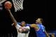 Mar 28, 2014; Indianapolis, IN, USA; Louisville Cardinals guard Russ Smith (2) shoots against Kentucky Wildcats guard Andrew Harrison (5) in the first half in the semifinals of the midwest regional of the 2014 NCAA Mens Basketball Championship tournament