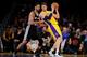 LOS ANGELES, CA - MARCH 19: Pau Gasol #16 of the Los Angeles Lakers handles the ball against Tim Duncan #21 of the San Antonio Spurs at Staples Center on March 19, 2014 in Los Angeles, California. NOTE TO USER: User expressly acknowledges and agrees that,