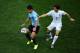 SAO PAULO, BRAZIL - JUNE 19: Nicolas Lodeiro of Uruguay controls the ball as Leighton Baines of England gives chase during the 2014 FIFA World Cup Brazil Group D match between Uruguay and England at Arena de Sao Paulo on June 19, 2014 in Sao Paulo, Brazi