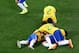 SAO PAULO, BRAZIL - JUNE 12: Oscar of Brazil lies on the ground in celebration with David Luiz (L), Dani Alves, Fred and Bernard during the 2014 FIFA World Cup Brazil Group A match between Brazil and Croatia at Arena de Sao Paulo on June 12, 2014 in Sao P