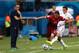 MANAUS, BRAZIL - JUNE 22: Joao Pereira of Portugal and Alejandro Bedoya of the United States compete for the ball as head coach Paulo Bento of Portugal looks during the 2014 FIFA World Cup Brazil Group G match between the United States and Portugal at Ar