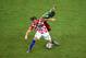 MANAUS, BRAZIL - JUNE 18: Ivan Rakitic of Croatia and Enoh Eyong of Cameroon compete for the ball during the 2014 FIFA World Cup Brazil Group A match between Cameroon and Croatia at Arena Amazonia on June 18, 2014 in Manaus, Brazil. (Photo by Stu Forst