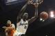Jan 18, 2014; Lawrence, KS, USA; Kansas Jayhawks center Joel Embiid (21) dunks the ball against Oklahoma State Cowboys guard Markel Brown (22) in the second half at Allen Fieldhouse. Kansas won 80-78. Mandatory Credit: John Rieger-USA TODAY Sports