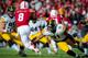 LINCOLN, NE - NOVEMBER 29: Linebacker Anthony Hitchens #31 of the Iowa Hawkeyes trips up running back Ameer Abdullah #8 of the Nebraska Cornhuskers during their game at Memorial stadium on November 29, 2013 in Lincoln, Nebraska. (Photo by Eric Francis/Get