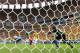 BRASILIA, BRAZIL - JUNE 23: Neymar of Brazil scores his team's first goal past Charles Itandje of Cameroon during the 2014 FIFA World Cup Brazil Group A match between Cameroon and Brazil at Estadio Nacional on June 23, 2014 in Brasilia, Brazil. (Photo by