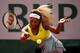 PARIS, FRANCE - MAY 28: Serena Williams of the United States returns a shot during her women's singles match against Garbine Muguruza of Spain on day four of the French Open at Roland Garros on May 28, 2014 in Paris, France. (Photo by Clive Brunskill/Ge