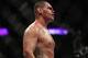 Oct 19, 2013; Houston, TX, USA; Cain Velasquez (red gloves) fights against Junior Dos Santos (not pictured) in the world heavyweight championship bout during UFC 166 at Toyota Center. Mandatory Credit: Andrew Richardson-USA TODAY Sports