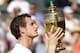 LONDON, ENGLAND - JULY 07: Andy Murray of Great Britain poses with the Gentlemen's Singles Trophy following his victory in the Gentlemen's Singles Final match against Novak Djokovic of Serbia on day thirteen of the Wimbledon Lawn Tennis Championships at