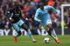 MANCHESTER, ENGLAND - MAY 11: Yaya Toure of Manchester City competes with Mohamed Diame of West Ham United during the Barclays Premier League match between Manchester City and West Ham United at the Etihad Stadium on May 11, 2014 in Manchester, England.