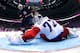 SOCHI, RUSSIA - FEBRUARY 15: T.J. Oshie #74 of the United States shoots on a shootout against Sergei Bobrovski #72 of Russia during the Men's Ice Hockey Preliminary Round Group A game on day eight of the Sochi 2014 Winter Olympics at Bolshoy Ice Dome on