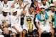 SAN ANTONIO, TX - JUNE 15: Kawhi Leonard #2, Tony Parker #9, Tim Duncan #21, Manu Ginobili #20, and Patty Mills #8 of the San Antonio Spurs celebrate with the Larry O'Brien trophy after defeating the Miami Heat to win the 2014 NBA Finals in Game Five of t